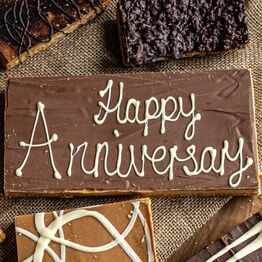 Large Message Flapjack Plaque With White Chocolate Message - Happy Anniversary